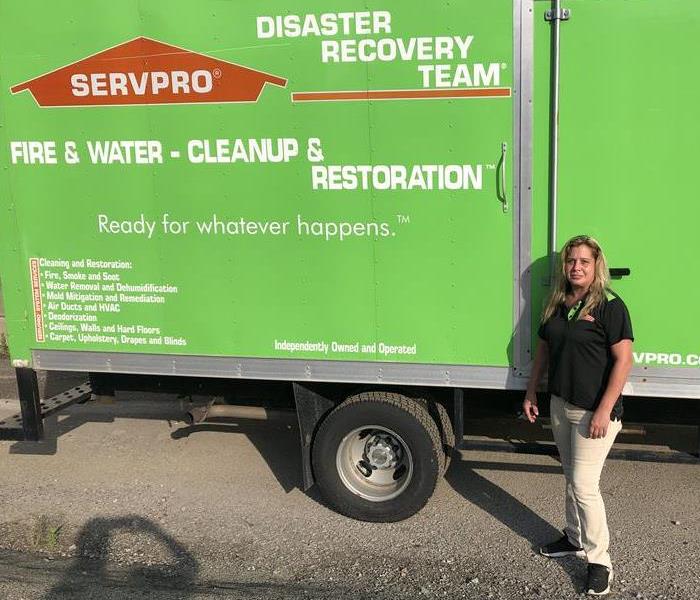 person in front of SERVPRO truck
